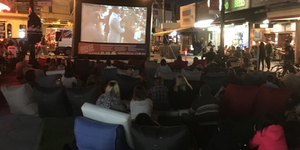 bean bags added to enjoyment of guest on pop up cinema in Acland Village, Melbourne